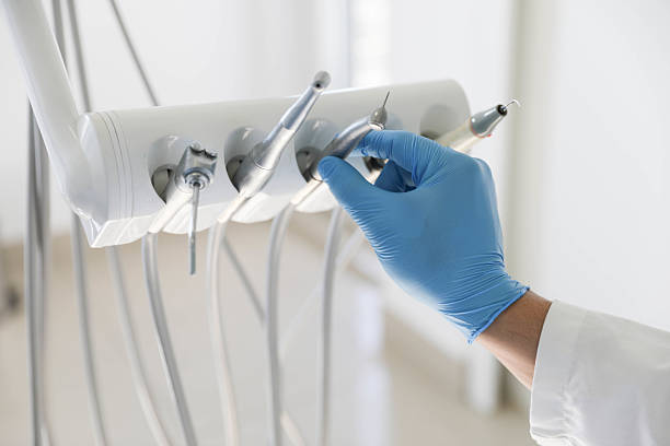 Professional Tooth Extraction technician working in Forest Hills, MI